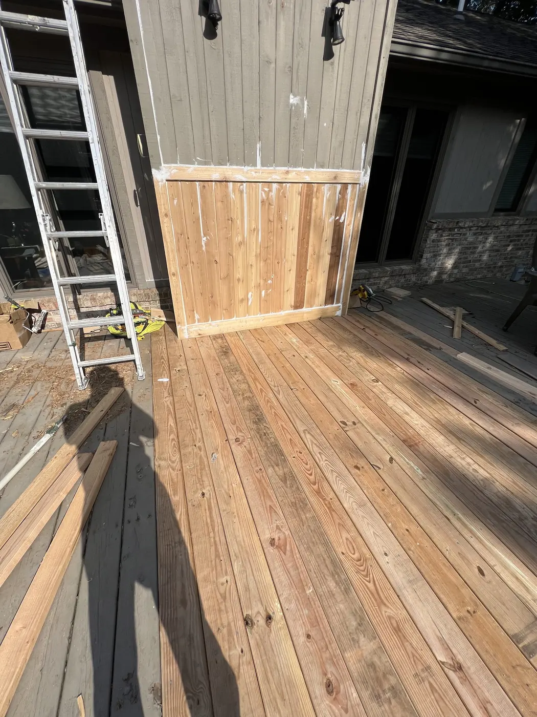 Exterior boards taken back to bare wood, ready for finish.